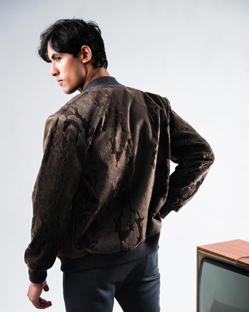 Draped in velvet charm and embraced by woolen warmth, this bomber jacket effortlessly fuses luxury with everyday style.